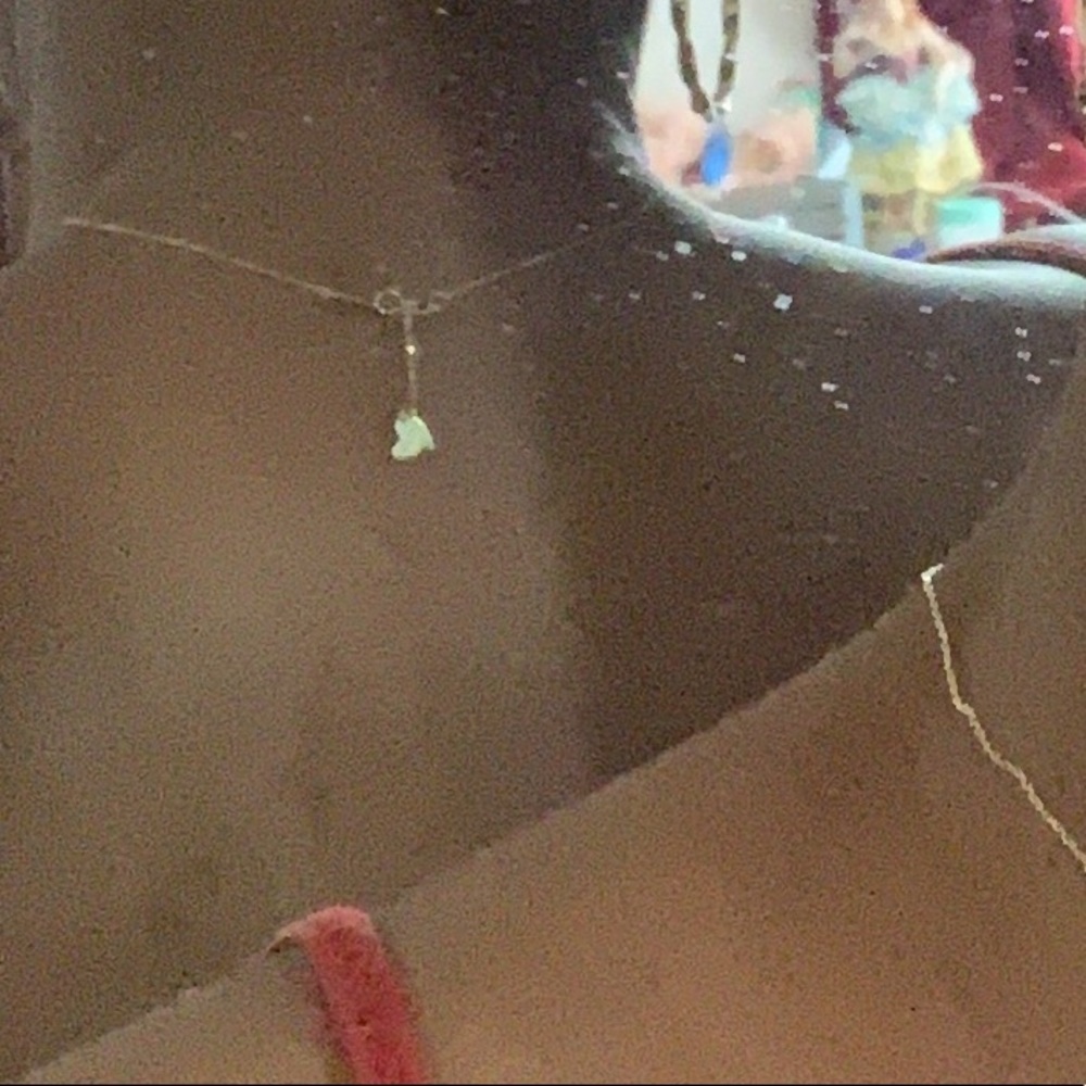 14k gold necklace with bolt in heart pendant.